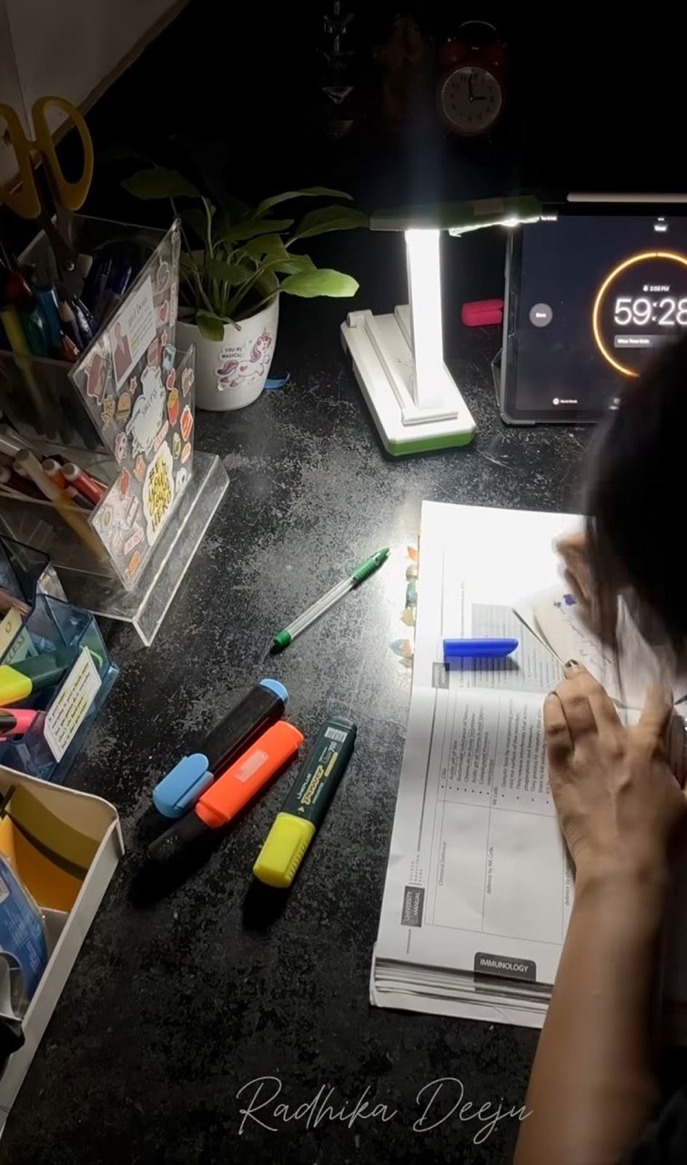 Radhika's NEET study desk with notes